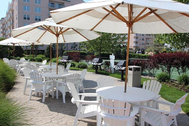 9905 Seapointe Blvd Unit 307, Lower Township, NJ 08260 - view of patio with outdoor dining space and grilling area