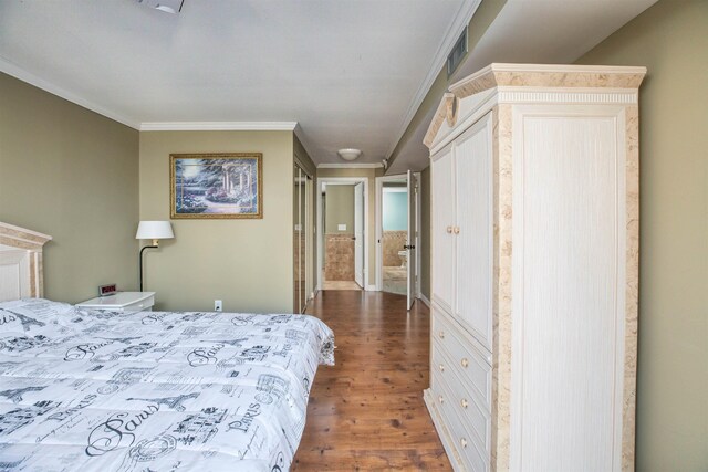 9905 Seapointe Blvd Unit 307, Lower Township, NJ 08260 - bedroom featuring ornamental molding and wood finished floors