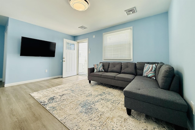 110 E 24th Ave Unit D, North Wildwood, NJ 08260 - living area featuring baseboards, wood finished floors, and visible vents