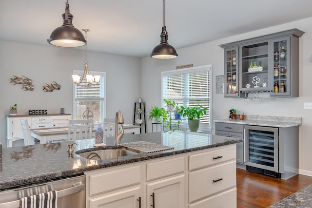 kitchen with a chandelier, stainless steel dishwasher, beverage cooler, and gray cabinets