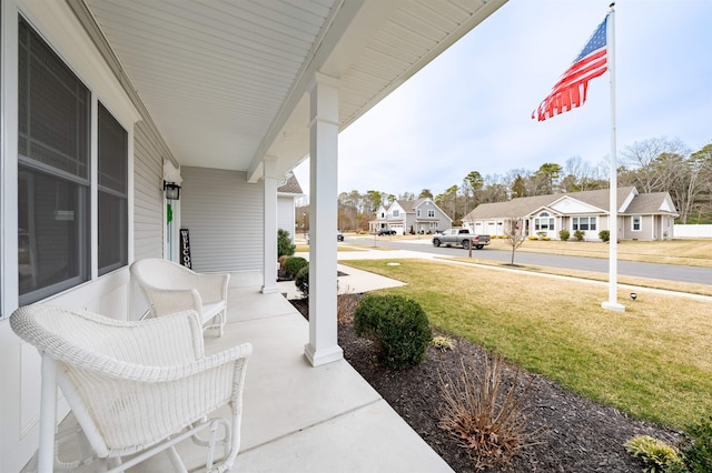 view of patio / terrace featuring a residential view and covered porch