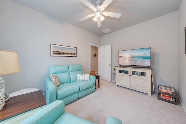 carpeted living room featuring a ceiling fan and visible vents