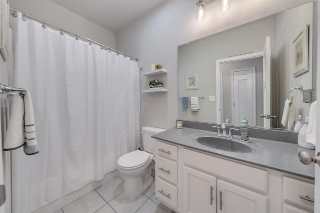 full bathroom with tile patterned floors, toilet, and vanity