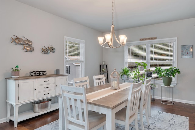 dining space featuring visible vents, baseboards, an inviting chandelier, and dark wood-style flooring