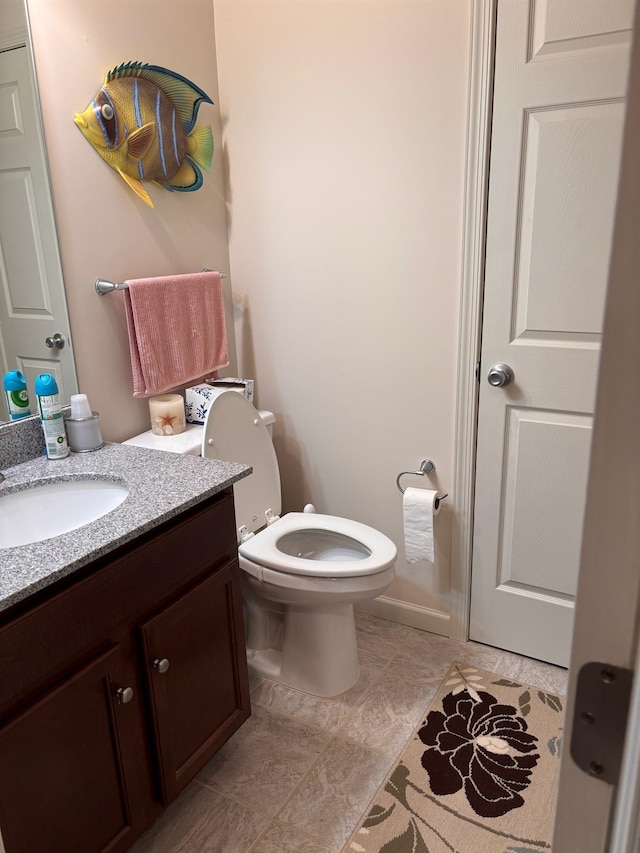 bathroom with toilet and vanity