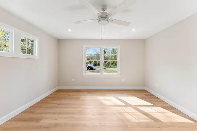 spare room with recessed lighting, light wood-style floors, and a healthy amount of sunlight