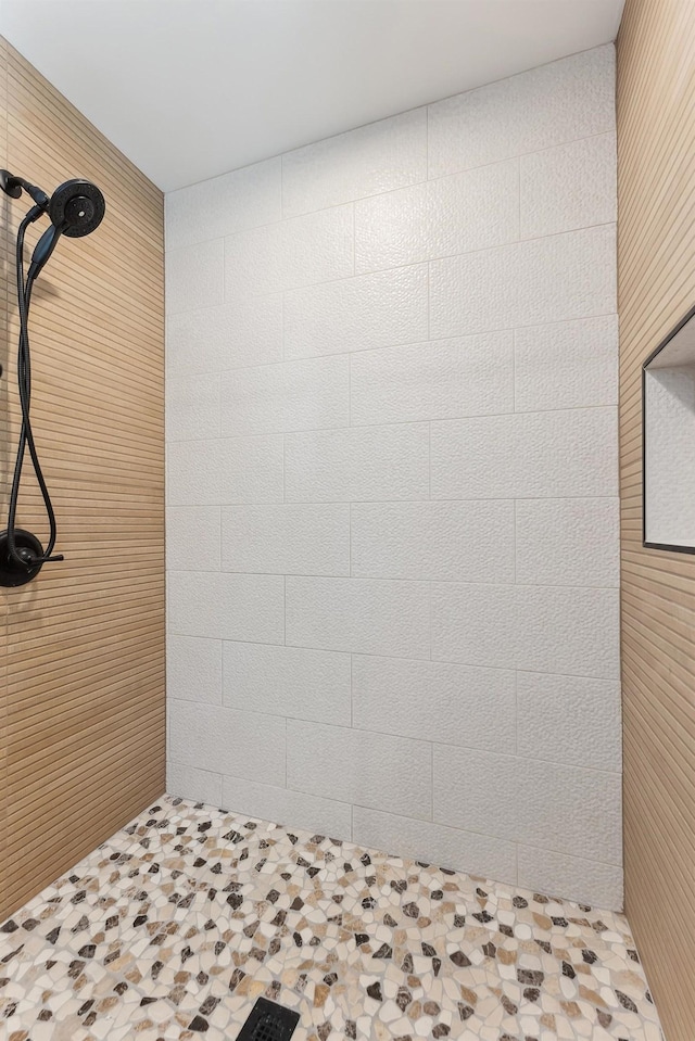 full bath featuring tiled shower