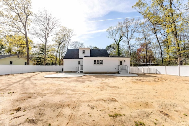 back of property featuring a patio, entry steps, crawl space, and a fenced backyard