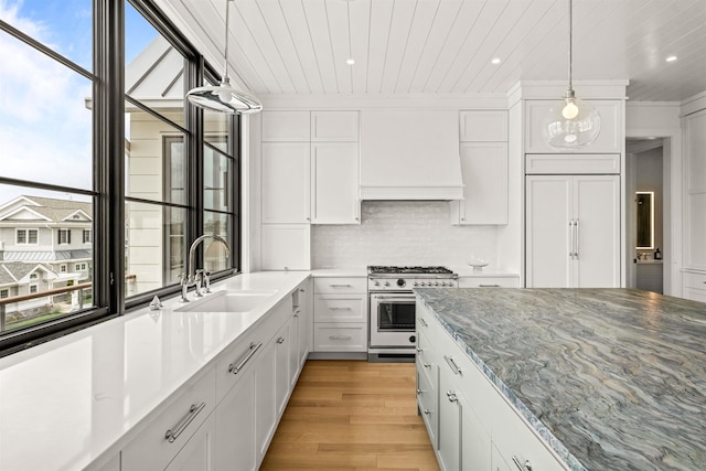 144 89th St, Stone Harbor, NJ 08247 - kitchen featuring high end stainless steel range, premium range hood, light wood-style floors, white cabinetry, and recessed lighting