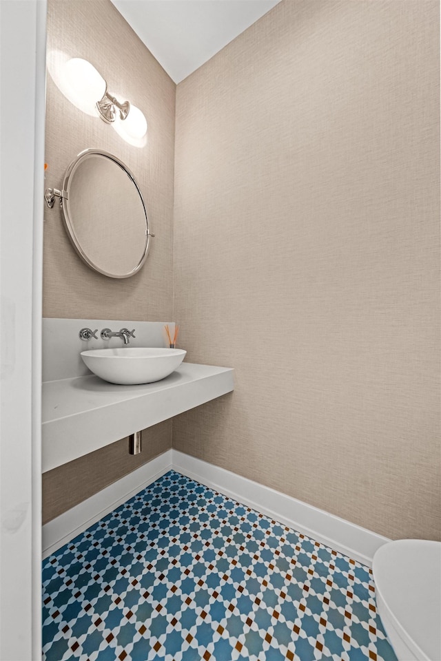 144 89th St, Stone Harbor, NJ 08247 - half bath with a sink and tile patterned floors