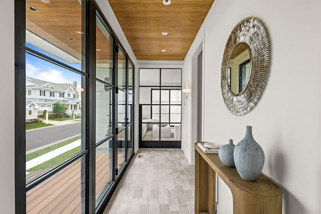 144 89th St, Stone Harbor, NJ 08247 - hallway with wooden ceiling, recessed lighting, and expansive windows