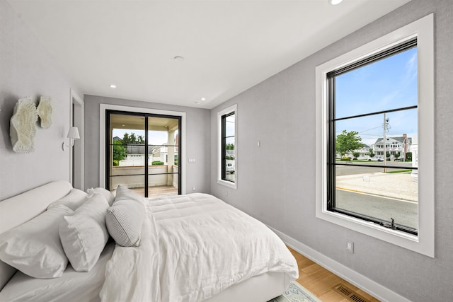 144 89th St, Stone Harbor, NJ 08247 - bedroom with wood finished floors, access to exterior, and recessed lighting