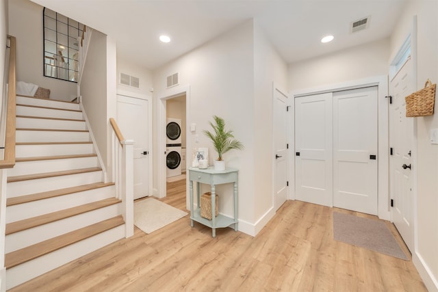 202 Osprey Dr Unit 202, Cape May Court House, NJ 08210 - foyer entrance with stacked washing machine and dryer, light wood-type flooring, stairs, and recessed lighting