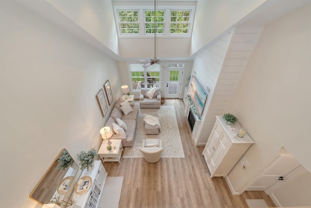 202 Osprey Dr Unit 202, Cape May Court House, NJ 08210 - living area with a towering ceiling, light wood finished floors, plenty of natural light, and ceiling fan