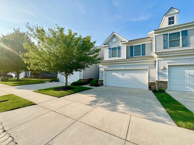 202 Osprey Dr Unit 202, Cape May Court House, NJ 08210 - view of front of home featuring driveway, stone siding, and a garage