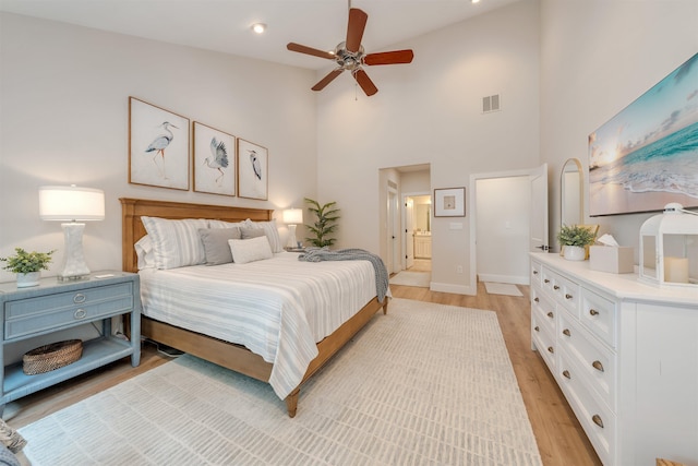 202 Osprey Dr Unit 202, Cape May Court House, NJ 08210 - bedroom featuring light wood-type flooring, high vaulted ceiling, connected bathroom, and a ceiling fan
