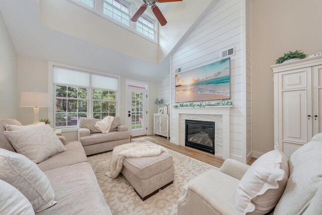 202 Osprey Dr Unit 202, Cape May Court House, NJ 08210 - living area featuring a ceiling fan, high vaulted ceiling, wood finished floors, and a glass covered fireplace