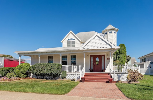 view of front of house with a front lawn and a porch