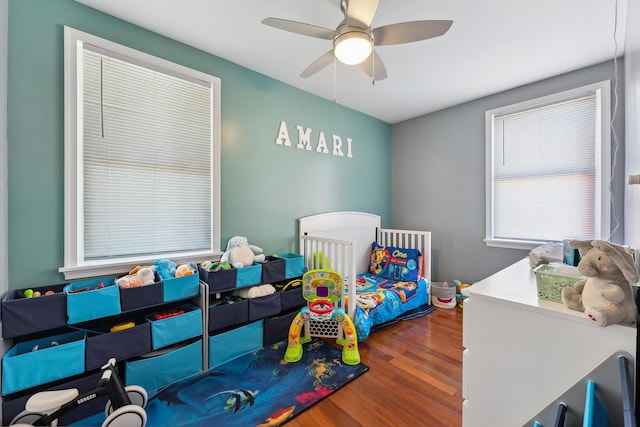 bedroom featuring ceiling fan and dark wood-type flooring