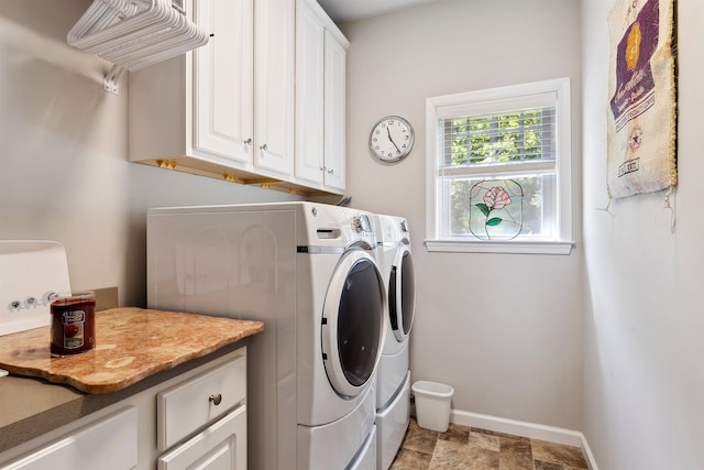 laundry area featuring cabinets and washer and dryer