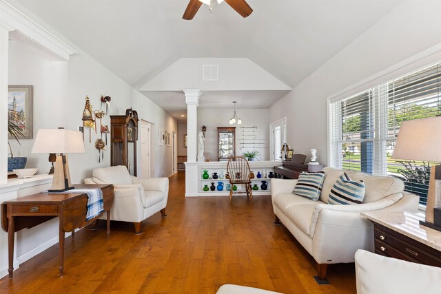 living room with ornate columns, ceiling fan, hardwood / wood-style floors, and lofted ceiling