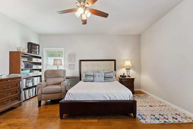 bedroom featuring ceiling fan and hardwood / wood-style floors