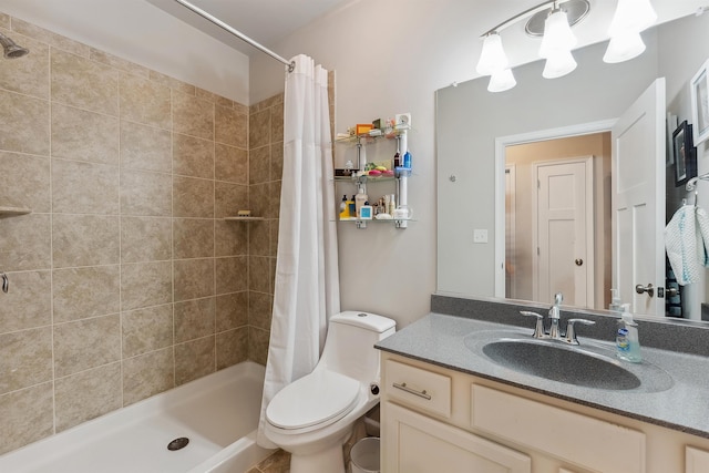 bathroom with vanity, toilet, and curtained shower