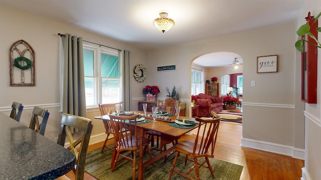 dining space featuring ceiling fan and hardwood / wood-style flooring