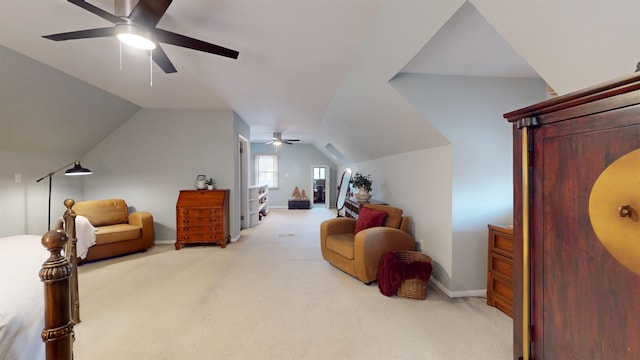 living area featuring ceiling fan, light colored carpet, and lofted ceiling