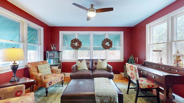 living room featuring hardwood / wood-style flooring and ceiling fan