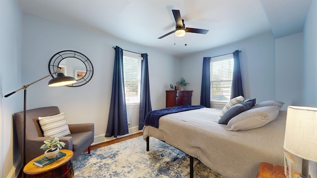 bedroom with wood-type flooring and ceiling fan