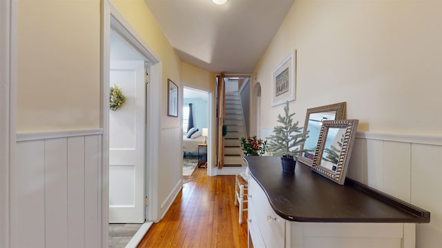 corridor with light hardwood / wood-style floors