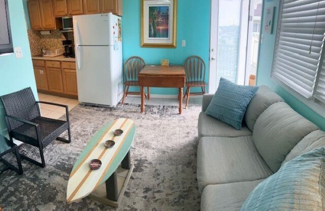 7203 Atlantic Ave Unit 302, Wildwood Crest, NJ 08260 - living room featuring light tile patterned flooring