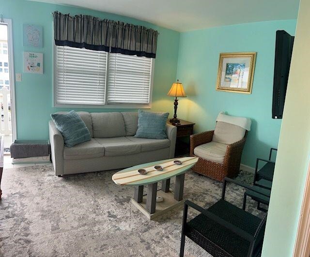 7203 Atlantic Ave Unit 302, Wildwood Crest, NJ 08260 - carpeted living room with baseboards