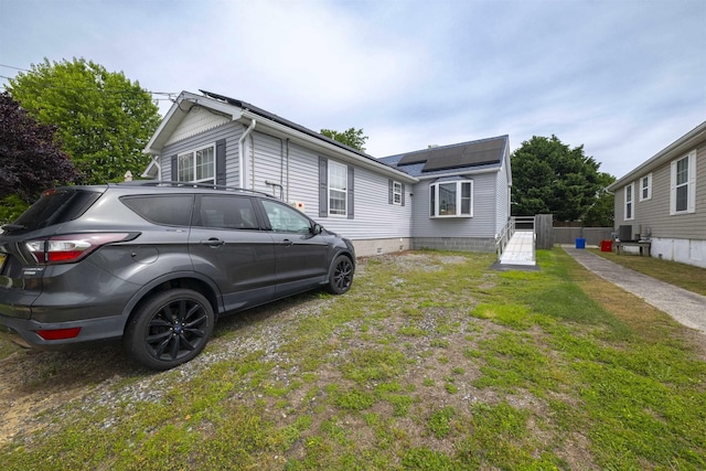 4 Rutledge Ave, Del Haven, NJ 08251 - view of front of house with roof mounted solar panels and a front yard