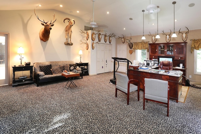 carpeted dining space featuring vaulted ceiling