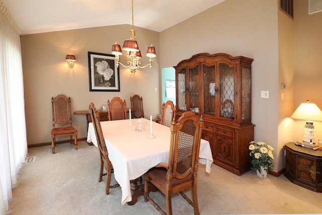 dining space featuring light colored carpet, lofted ceiling, and an inviting chandelier