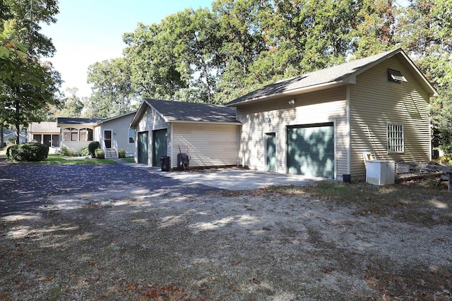 view of side of property with a garage