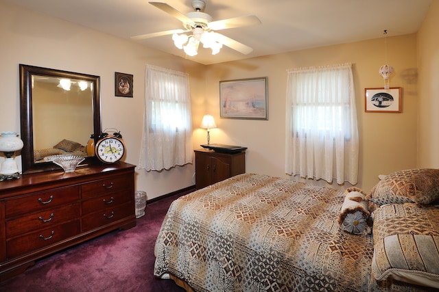 bedroom with dark carpet and ceiling fan