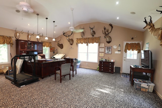 kitchen featuring ceiling fan, carpet floors, hanging light fixtures, and lofted ceiling