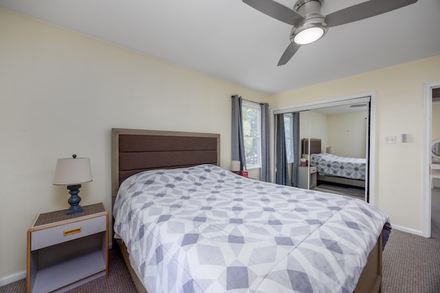 bedroom featuring ceiling fan, a closet, and dark carpet