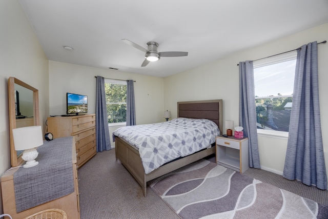 bedroom featuring ceiling fan and light colored carpet