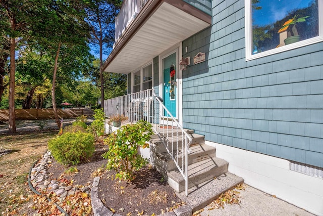 doorway to property with a porch