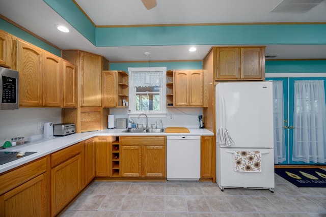 kitchen featuring white appliances and sink