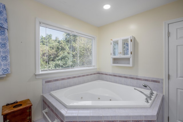 bathroom with tiled tub