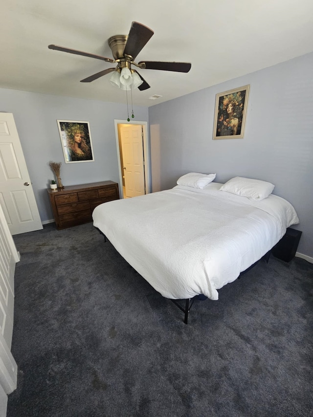 bedroom with carpet floors, ceiling fan, and baseboards