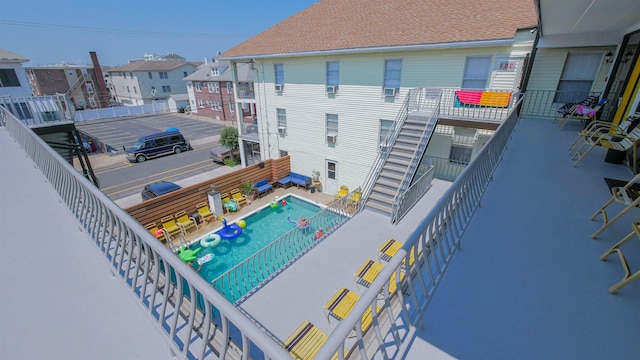 view of swimming pool featuring a residential view