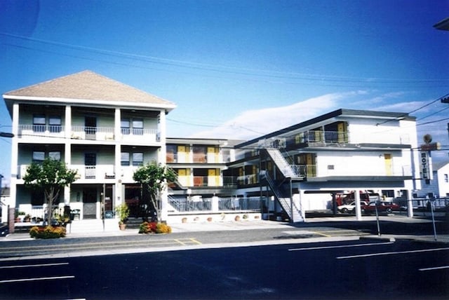 view of property with uncovered parking