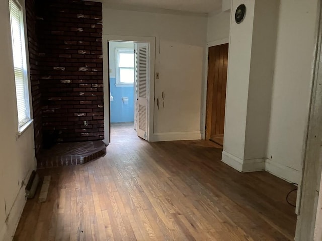 unfurnished room featuring hardwood / wood-style floors