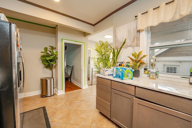 220 E 21st Ave, North Wildwood, NJ 08260 - kitchen featuring baseboards, ornamental molding, stainless steel fridge, and light tile patterned floors